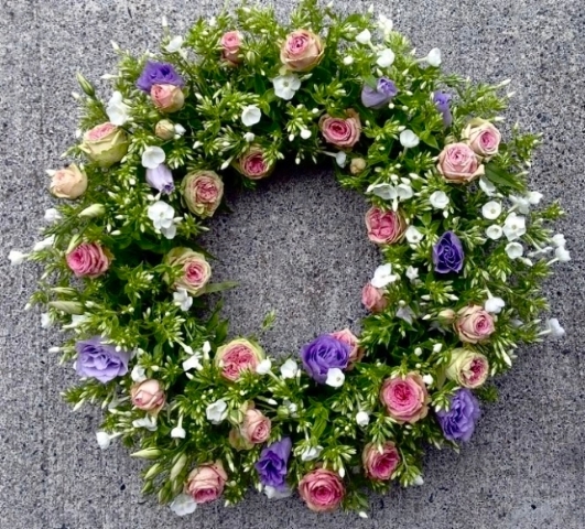 A natural base of summer floral foliage with rose buds and lissyanthus