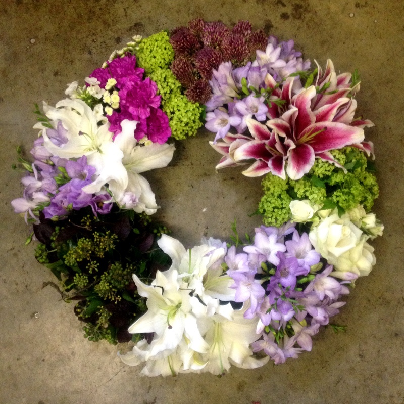 A Circular Wreath Of Grouped Flowers